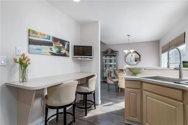 a kitchen with stainless steel appliances a sink and a refrigerator