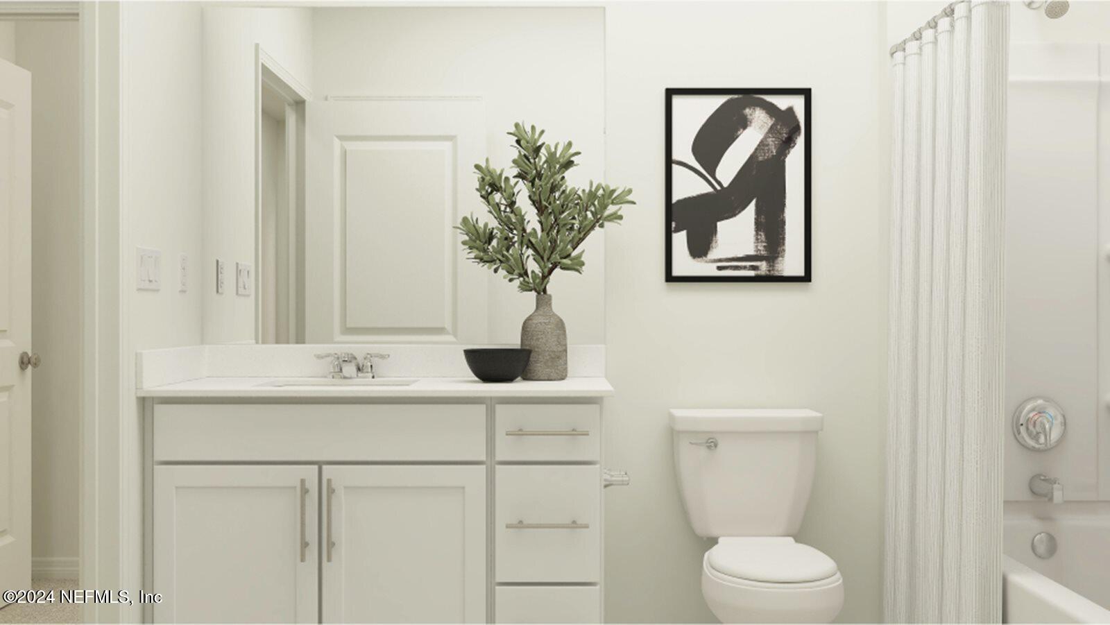 1427 Eddy Road Jacksonville, FL 32211 - Photo 7 of 19 a bathroom with a toilet a sink and mirror