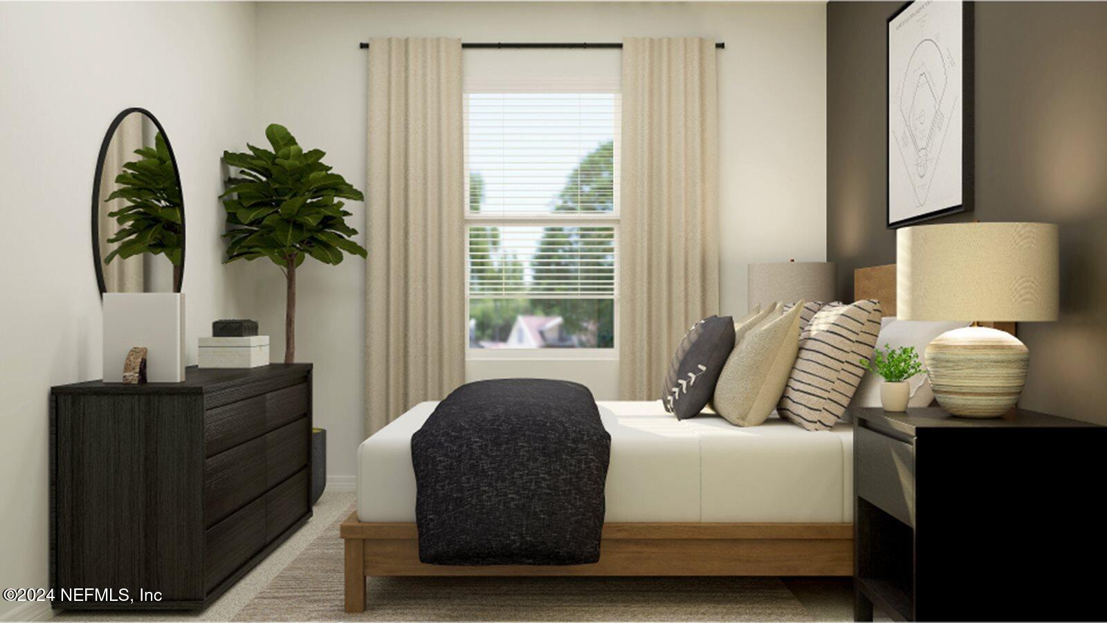 1427 Eddy Road Jacksonville, FL 32211 - Photo 9 of 19 a bedroom with a bed and a potted plant