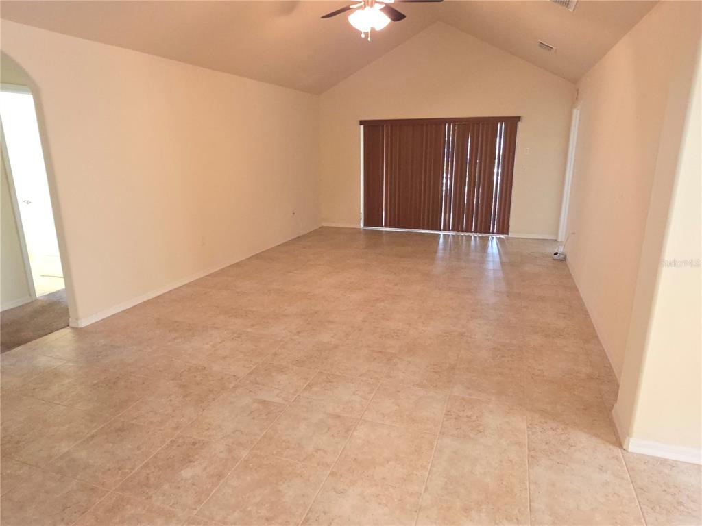 4284 High Ridge Avenue Spring Hill, FL 34609 - Photo 6 of 40 an empty room with window and hallway