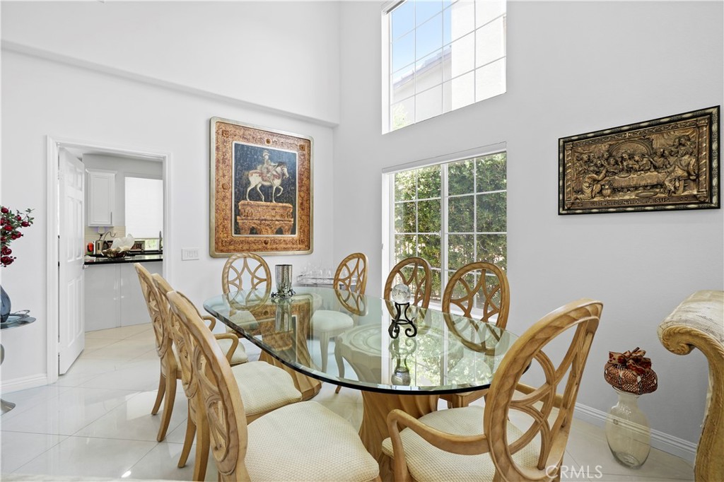 20621 Pesaro Way Porter Ranch, CA 91326 - Photo 11 of 45 a dining room with furniture and window