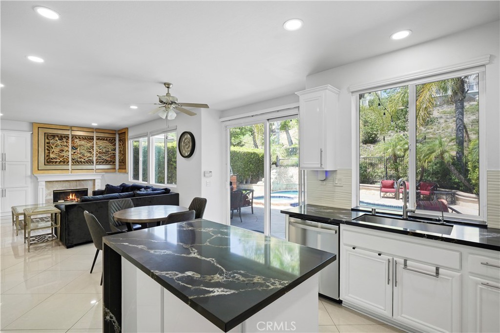 20621 Pesaro Way Porter Ranch, CA 91326 - Photo 13 of 45 a kitchen with counter top space a sink and appliances