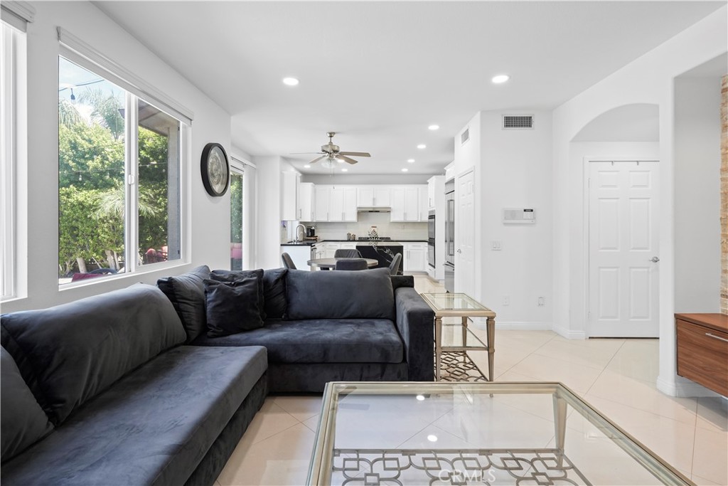20621 Pesaro Way Porter Ranch, CA 91326 - Photo 18 of 45 a living room with furniture and a large window