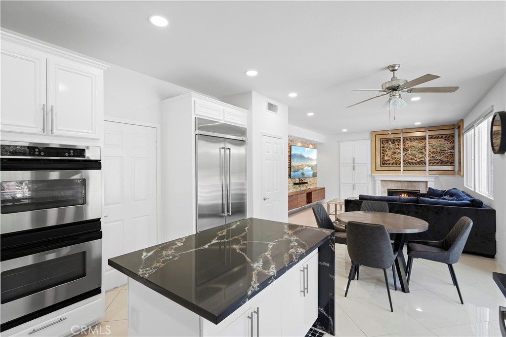 20621 Pesaro Way Porter Ranch, CA 91326 - Photo 20 of 45 a kitchen with stainless steel appliances granite countertop a sink a stove and a refrigerator