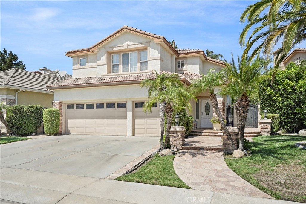 20621 Pesaro Way Porter Ranch, CA 91326 - Photo 2 of 45 front view of house with a yard
