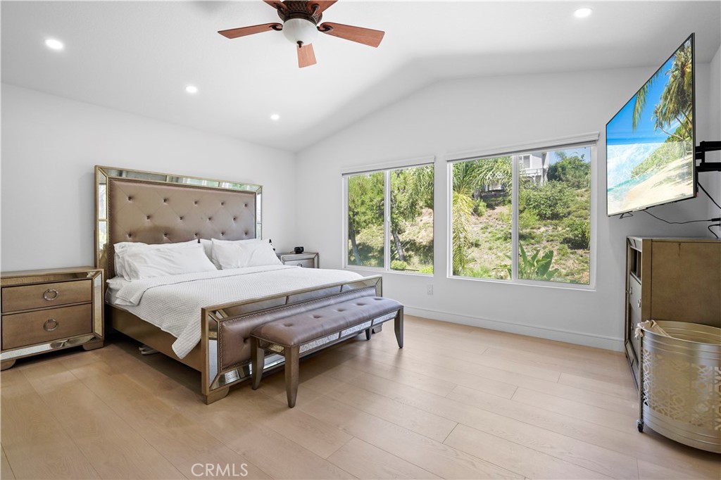 20621 Pesaro Way Porter Ranch, CA 91326 - Photo 21 of 45 a bed sitting in a room next to a window