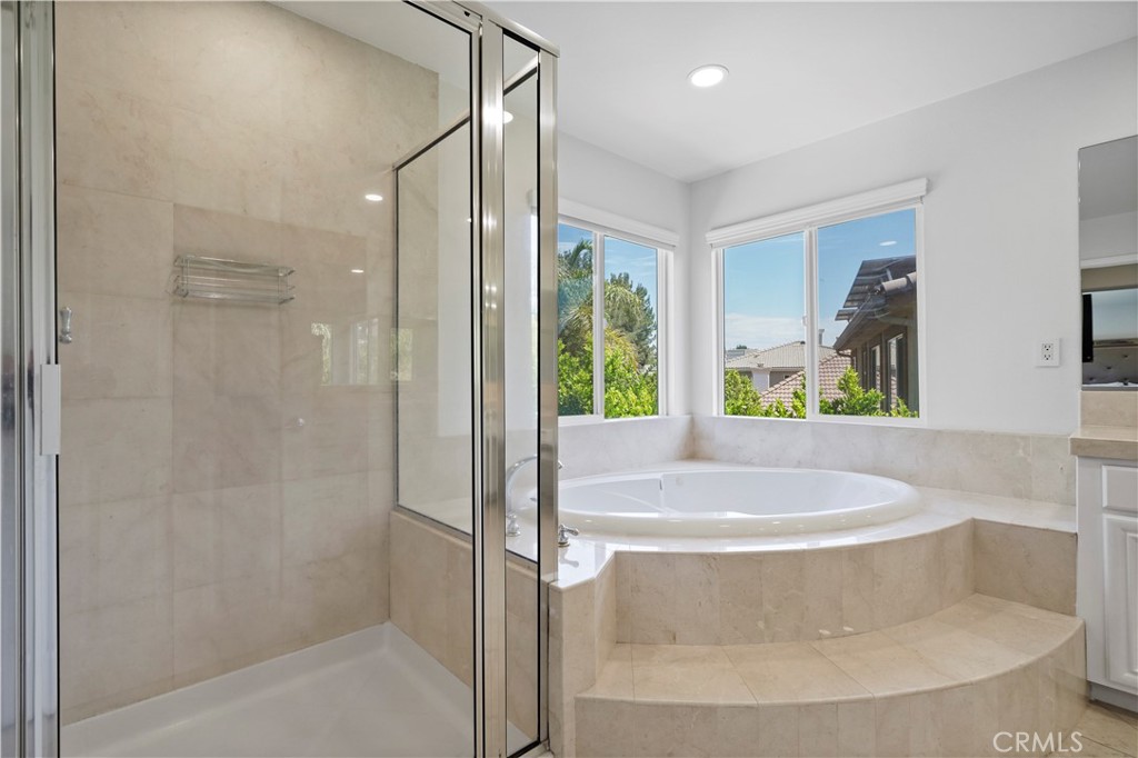 20621 Pesaro Way Porter Ranch, CA 91326 - Photo 24 of 45 a bath tub sitting in a bathroom