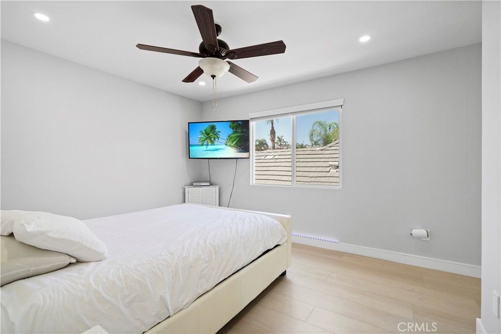 20621 Pesaro Way Porter Ranch, CA 91326 - Photo 26 of 45 a bedroom with a bed and a window