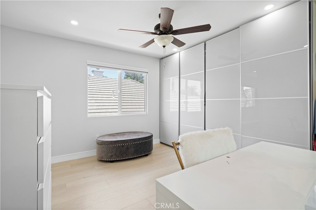 20621 Pesaro Way Porter Ranch, CA 91326 - Photo 28 of 45 a living room with furniture and a ceiling fan