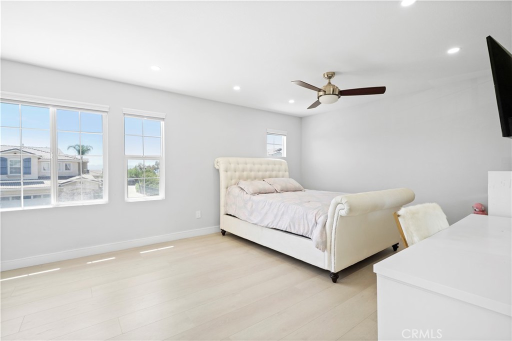 20621 Pesaro Way Porter Ranch, CA 91326 - Photo 30 of 45 a bedroom with a bed and window