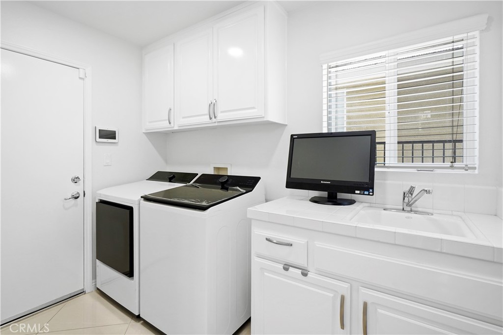 20621 Pesaro Way Porter Ranch, CA 91326 - Photo 35 of 45 a kitchen with stainless steel appliances granite countertop a sink and a stove