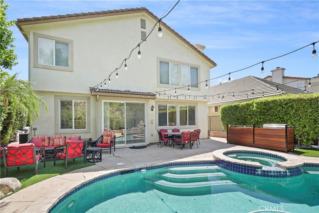 20621 Pesaro Way Porter Ranch, CA 91326 - Photo 37 of 45 a building outdoor space with patio furniture and potted plants