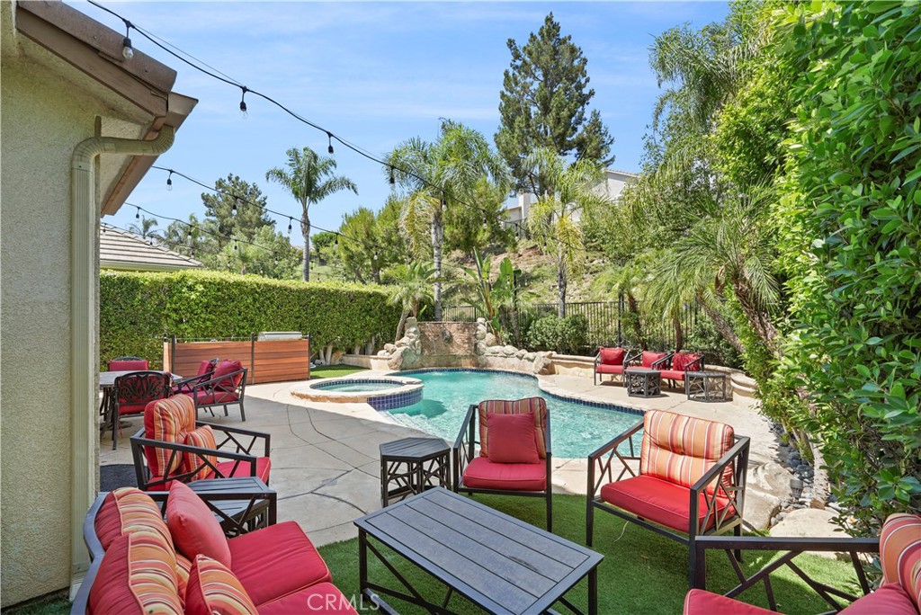 20621 Pesaro Way Porter Ranch, CA 91326 - Photo 38 of 45 an outdoor sitting area with couch and outdoor view