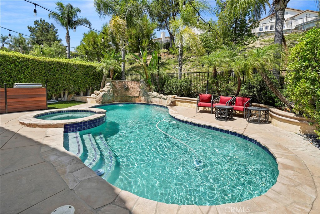 20621 Pesaro Way Porter Ranch, CA 91326 - Photo 39 of 45 a view of a swimming pool with a patio