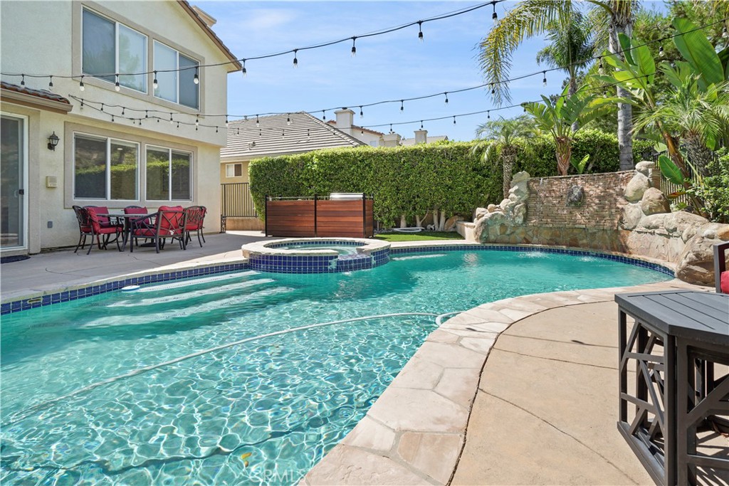 20621 Pesaro Way Porter Ranch, CA 91326 - Photo 40 of 45 a view of a backyard with sitting area and furniture