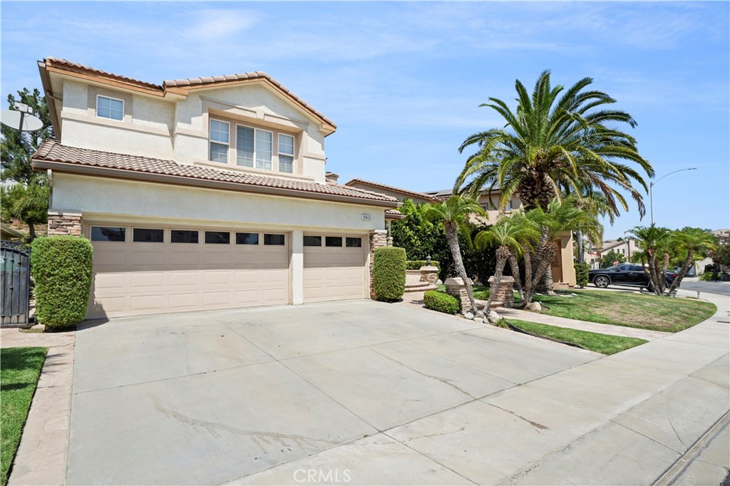 20621 Pesaro Way Porter Ranch, CA 91326 - Photo 45 of 45 a front view of house with yard and trees around