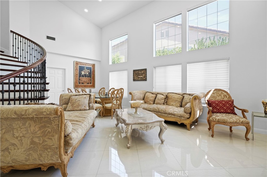 20621 Pesaro Way Porter Ranch, CA 91326 - Photo 5 of 45 a living room with furniture and a large window