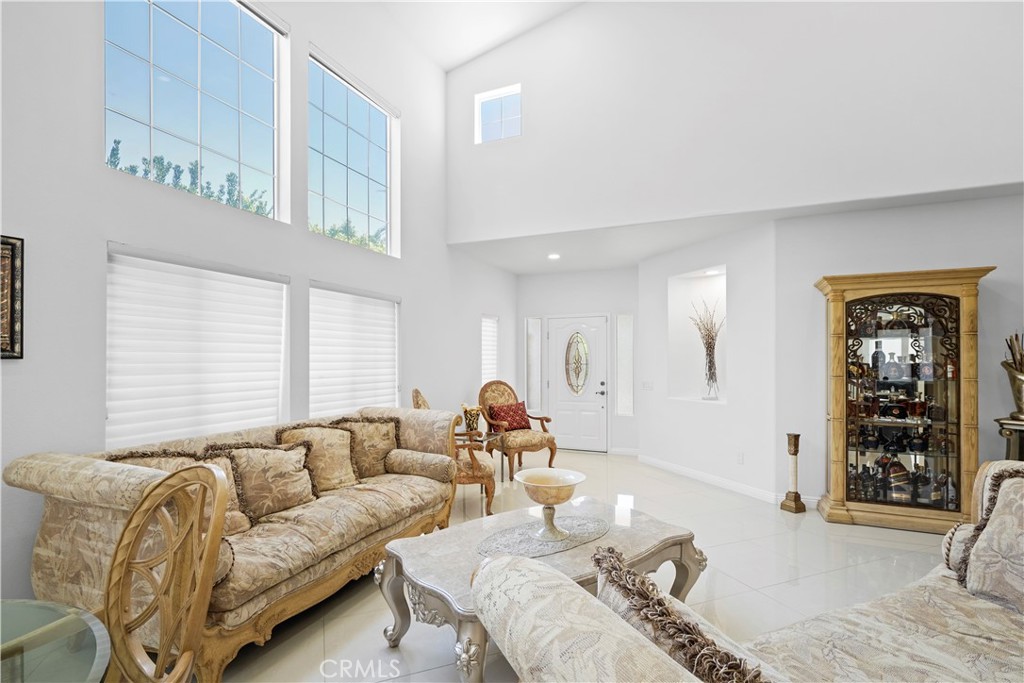 20621 Pesaro Way Porter Ranch, CA 91326 - Photo 6 of 45 a living room with furniture and window