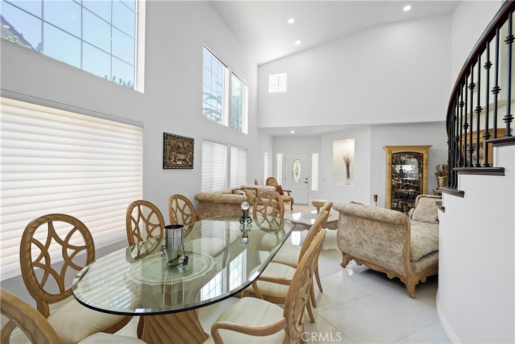 20621 Pesaro Way Porter Ranch, CA 91326 - Photo 8 of 45 a dining room with furniture and wooden floor