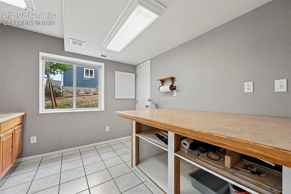 12571 Scamper Road Peyton, CO 80831 - Photo 30 of 49 Basement hobby area
