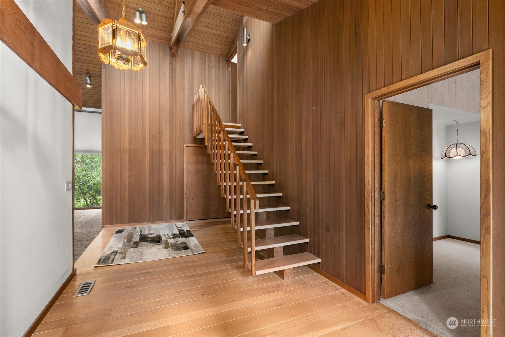 289 Kennicott Road Chehalis, WA 98532 - Photo 12 of 40 a view of a hallway with wooden cabinets and stairs