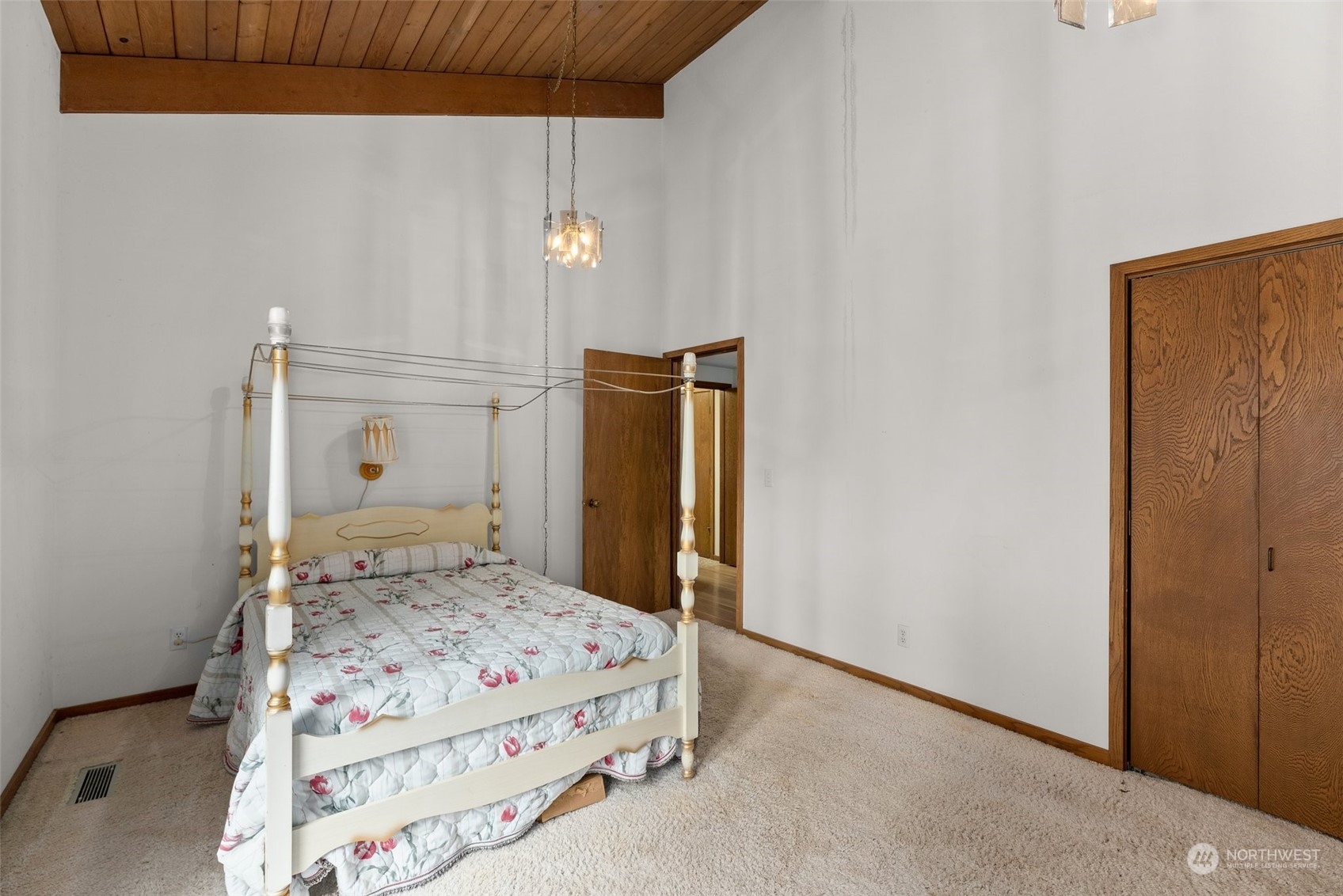 289 Kennicott Road Chehalis, WA 98532 - Photo 21 of 40 a bedroom with a bed and wooden floor