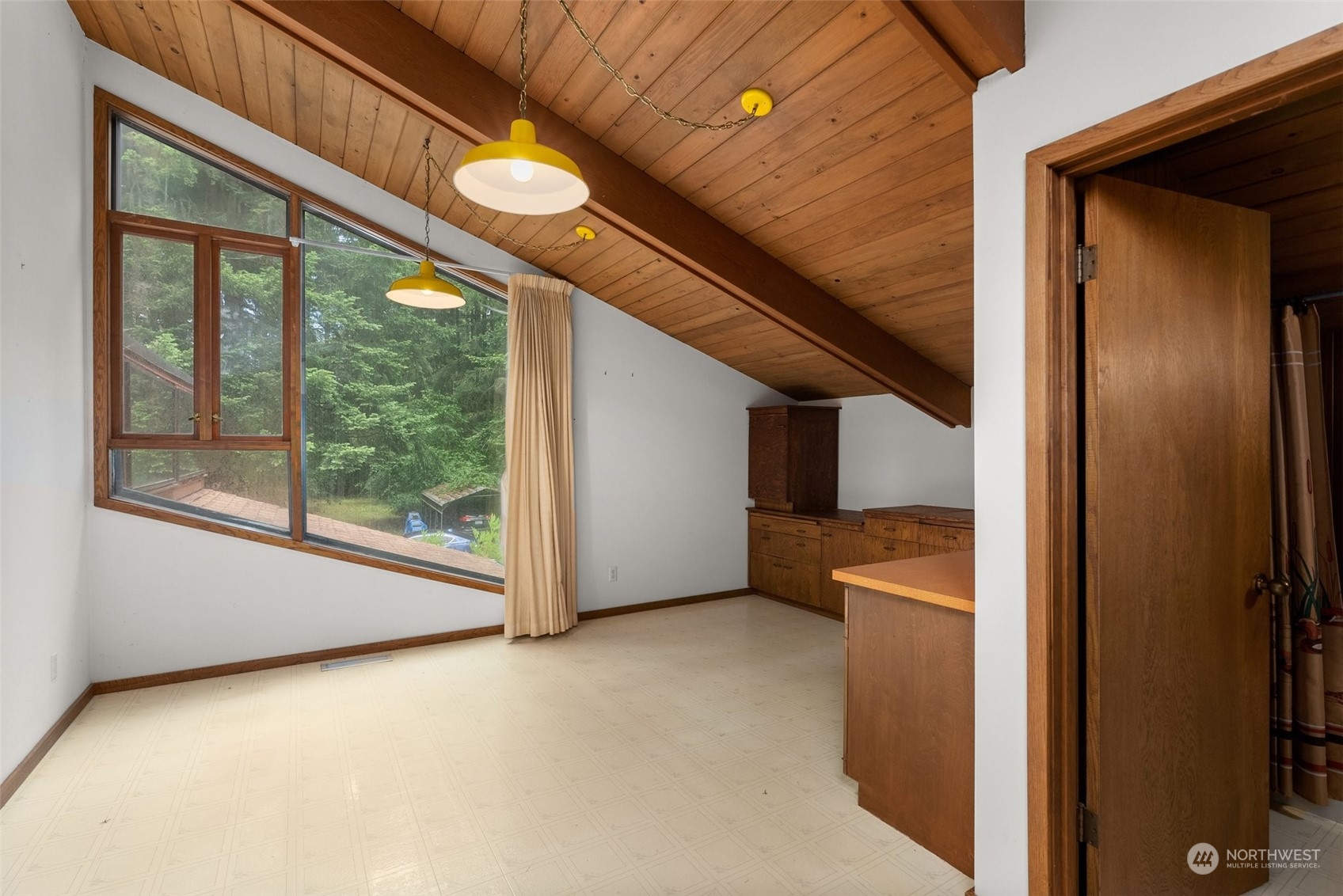 289 Kennicott Road Chehalis, WA 98532 - Photo 23 of 40 a view of a room with a large window and wooden floor