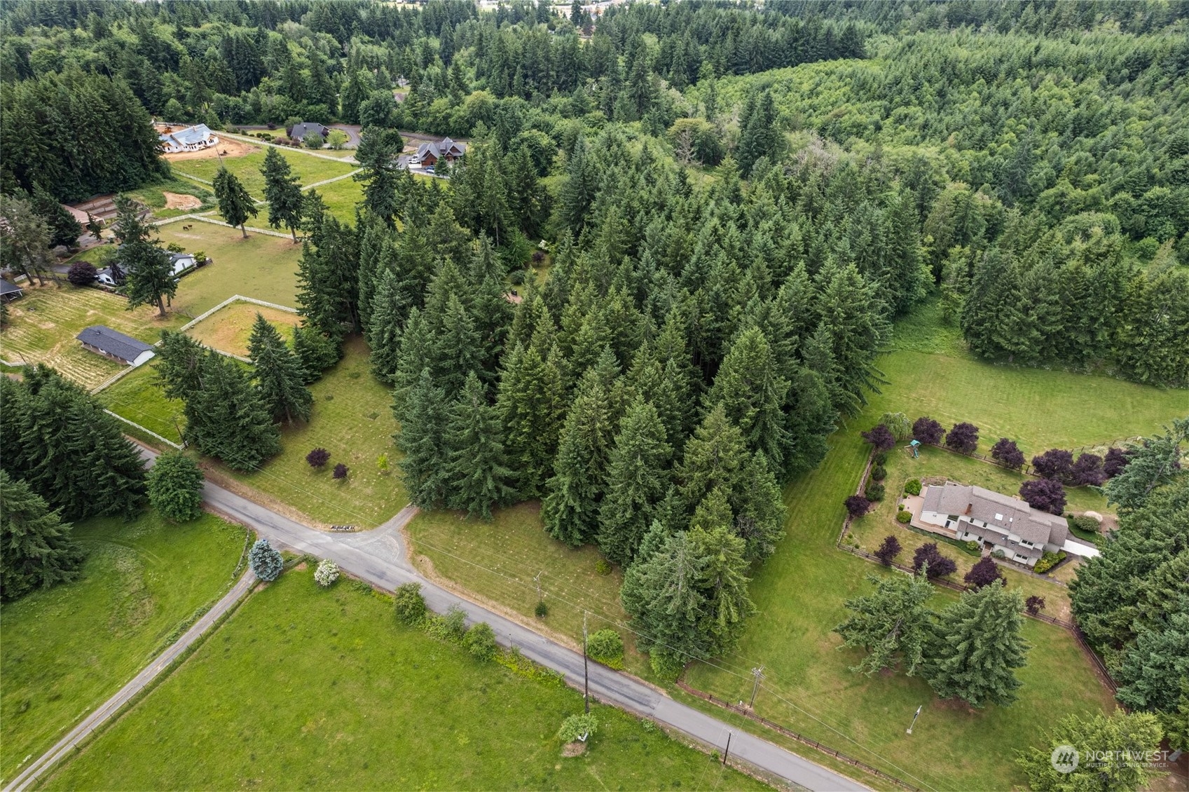 289 Kennicott Road Chehalis, WA 98532 - Photo 32 of 40 a view of a yard with a lake view