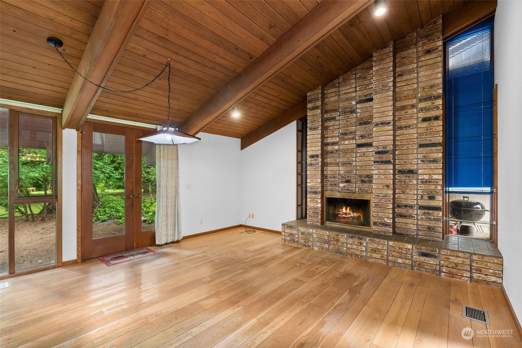 289 Kennicott Road Chehalis, WA 98532 - Photo 5 of 40 a view of empty room with wooden floor and fireplace