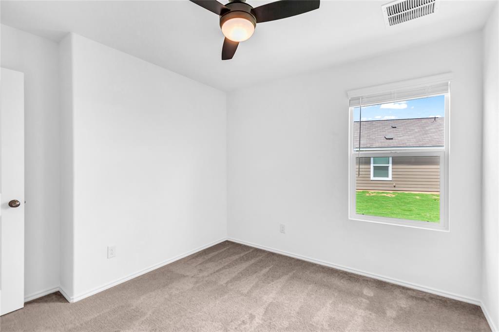 516 Rancho Del Cielo Loop Jarrell, TX 76537 - Photo 27 of 33 a view of an empty room with a window