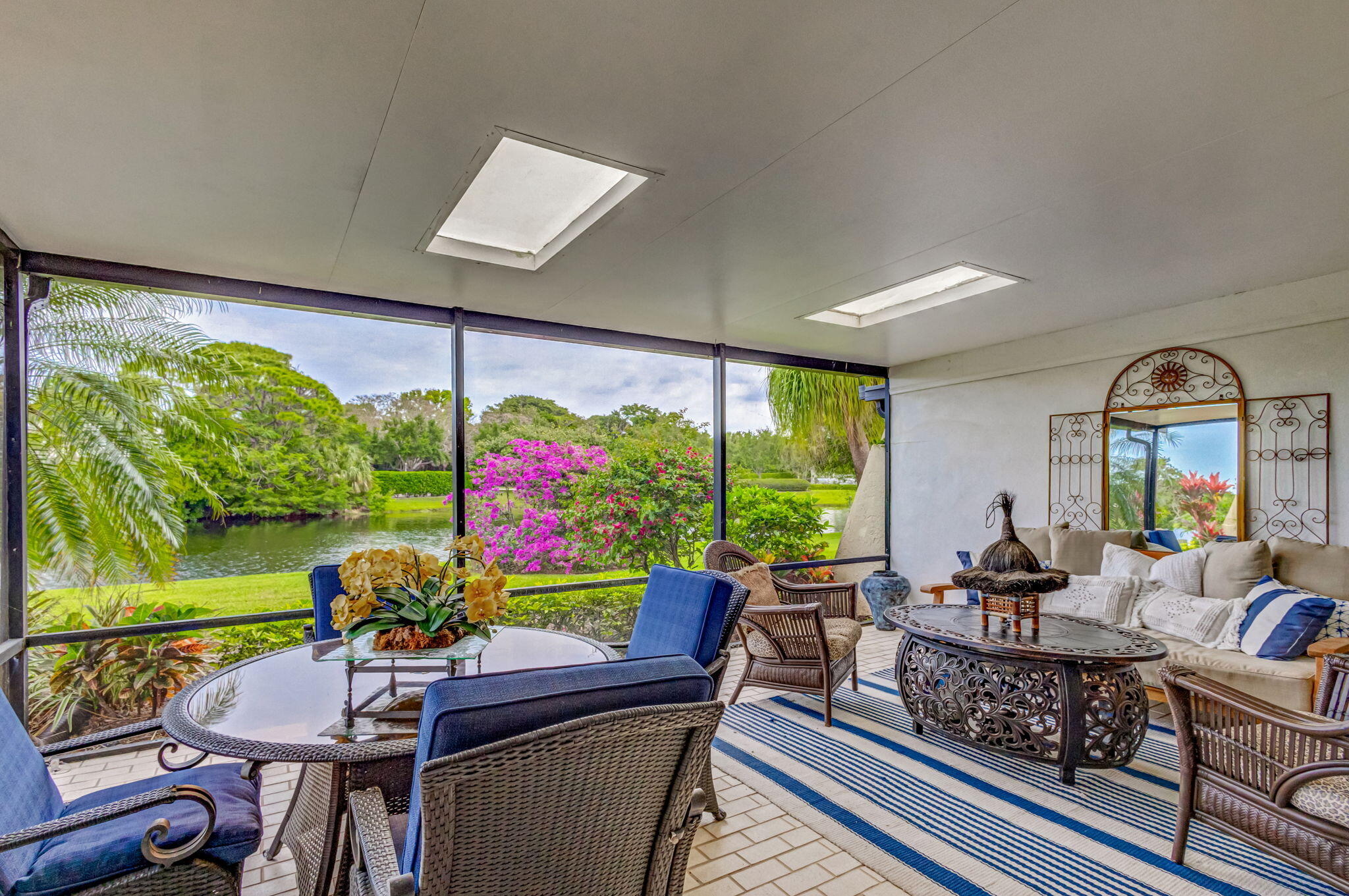 3667 Cape Pointe Circle Jupiter, FL 33477 - Photo 1 of 37 a living room with furniture and a large window