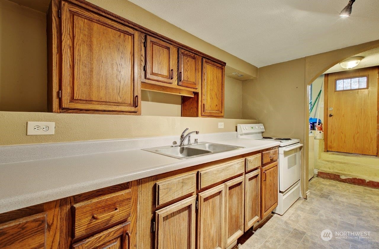 3906 South Pilgrim Street Seattle, WA 98118 - Photo 13 of 29 a bathroom with a sink a vanity and a mirror