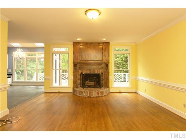 4017 John S Raboteau Wynd Raleigh, NC 27612 - Photo 4 of 12 Family room features attractive brick fireplace