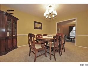601 Trail Ridge Road Matthews, NC 28105 - Photo 7 of 16 a view of a dining room with furniture and chandelier