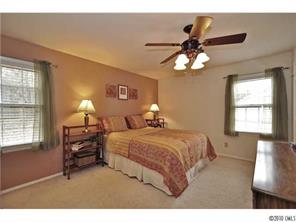 601 Trail Ridge Road Matthews, NC 28105 - Photo 9 of 16 a bedroom with bed window and furniture