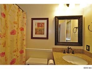 601 Trail Ridge Road Matthews, NC 28105 - Photo 10 of 16 a bathroom with a sink and a mirror