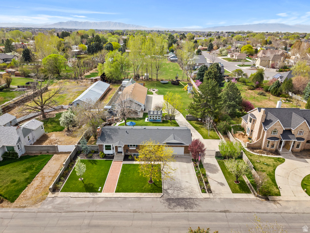 141 North 600 East Mapleton, UT 84664 - Photo 43 of 44 Aerial perspective of the .88 acre home with workshop, barn, greenhouse, outdoor kitchen, gazebo, pond, firepit, play area, and a lifetime of fun!