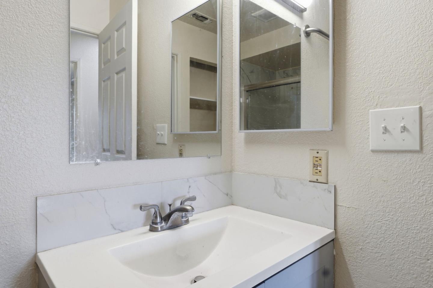 7283 Florin Road, Unit 8 Sacramento, CA 95828 - Photo 26 of 35 a bathroom with a sink and a mirror