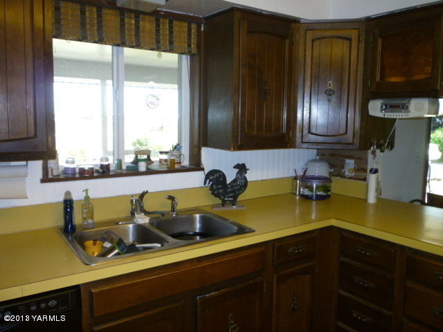 1330 Branch Road Toppenish, WA 98948 - Photo 11 of 22 a kitchen with a sink and cabinets