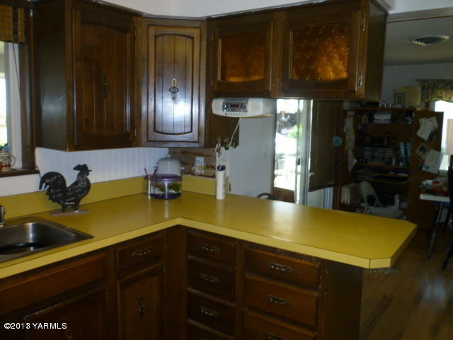 1330 Branch Road Toppenish, WA 98948 - Photo 5 of 22 a kitchen with a sink and cabinets