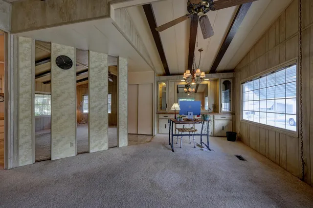 a view of hall way with furniture