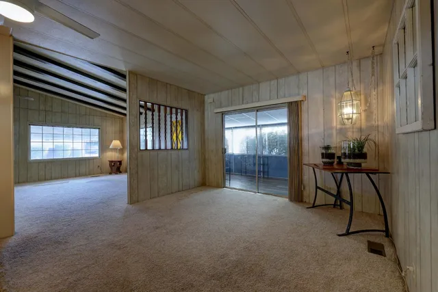 a view of a livingroom with furniture and windows