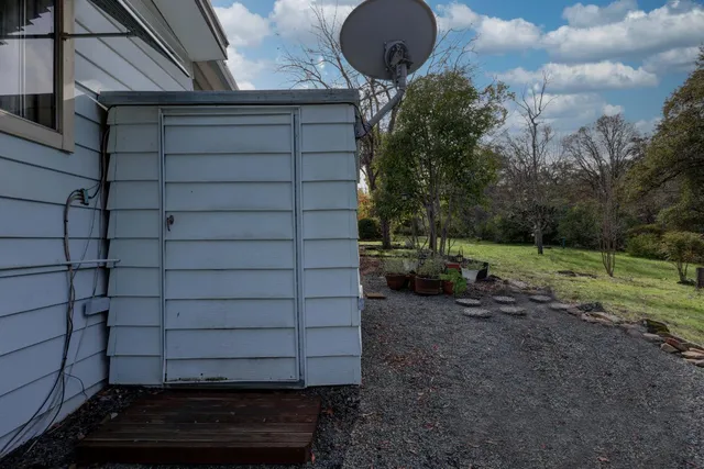 a backyard of a house with lots of green space