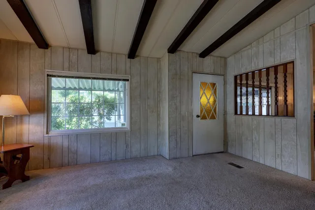 a view of an empty room with a window