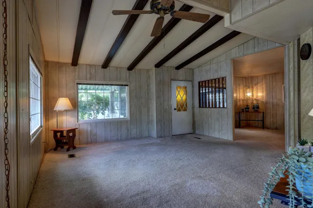 a view of livingroom with furniture and windows