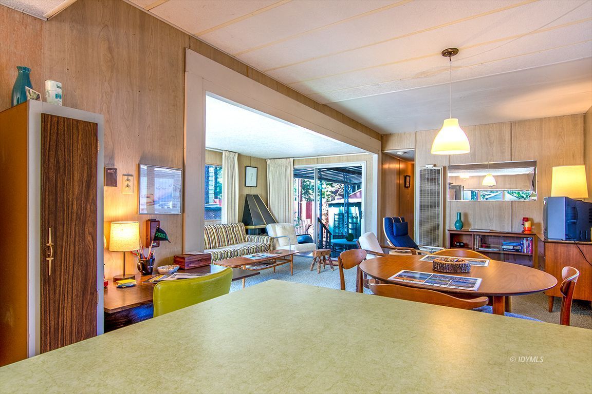 52901 Pine Cove Road, Unit 5 Idyllwild, CA 92549 - Photo 27 of 35 a living room with furniture a rug and a large window