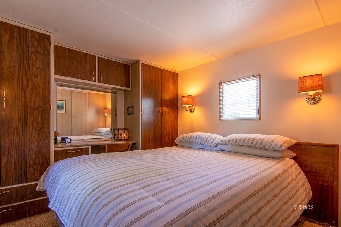 52901 Pine Cove Road, Unit 5 Idyllwild, CA 92549 - Photo 28 of 35 a bedroom with a large bed and a window