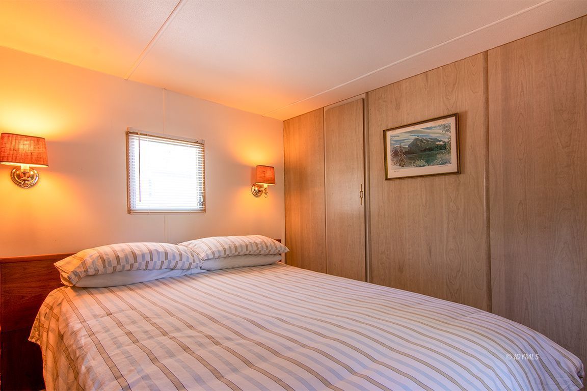 52901 Pine Cove Road, Unit 5 Idyllwild, CA 92549 - Photo 30 of 35 a bedroom with a bed and a window