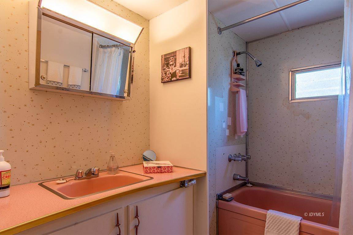 52901 Pine Cove Road, Unit 5 Idyllwild, CA 92549 - Photo 31 of 35 a bathroom with a sink and a mirror