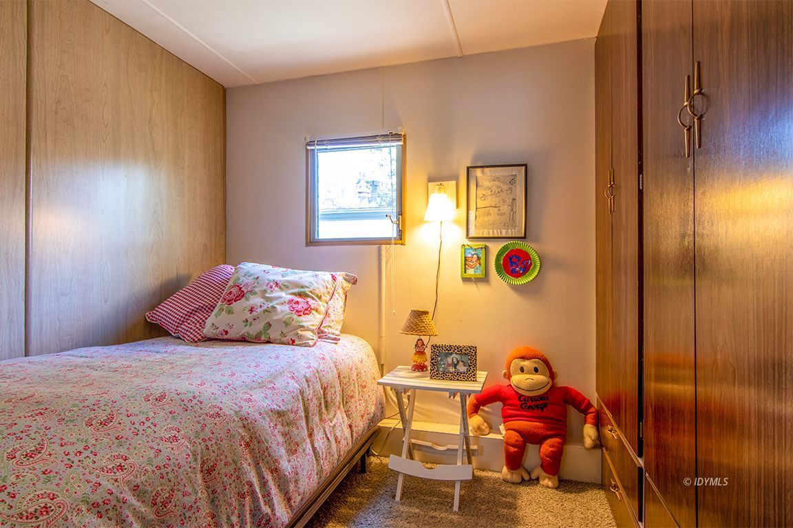 52901 Pine Cove Road, Unit 5 Idyllwild, CA 92549 - Photo 32 of 35 a bedroom with a bed and a window